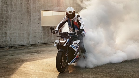 M R burning out the rear tyre